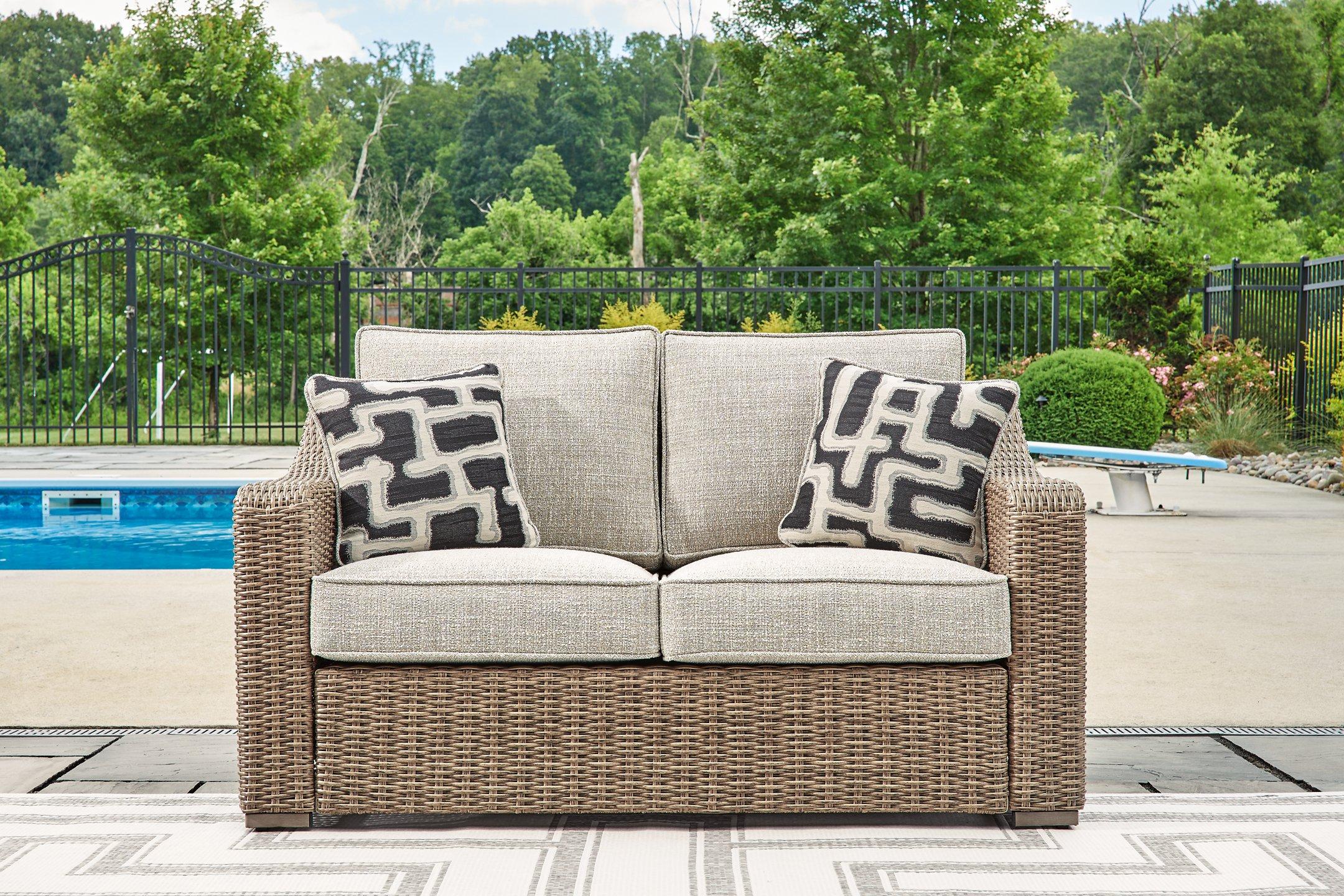 Beachcroft Outdoor Loveseat with Cushion - Joseph's Furniture (East Orange, NJ)